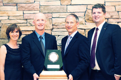 Michael Latimer and Mike Van Ham (center) accepting the 2009 British Columbia Jake McDonald Annual Mine Reclamation award on behalf of Lehigh Materials, Sechelt Mine.