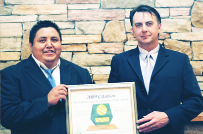 Lloyd French and Richard Beck of UTM Geological Services, accepting the Category Reclamation Award for outstanding Mineral Exploration Reclamation at Lustdust on behalf of Alpha Gold Corporation.