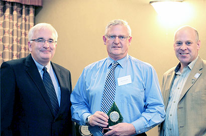 Bruce Donald accepting the “keeper trophy” on behalf of the Teck Highland Valley Copper Partnership for Highland Valley Copper Mine. Presenting the “keeper trophy” are Pierre Gratton, president and CEO of the Mining Association of BC (left) and Al Hoffman, Chief Inspector of Mines (right).